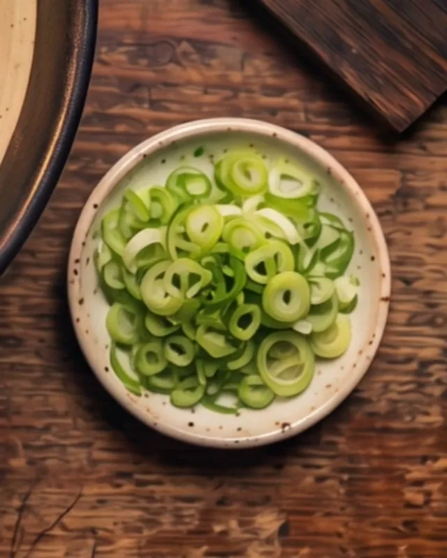 A small dish of finely sliced green scallion