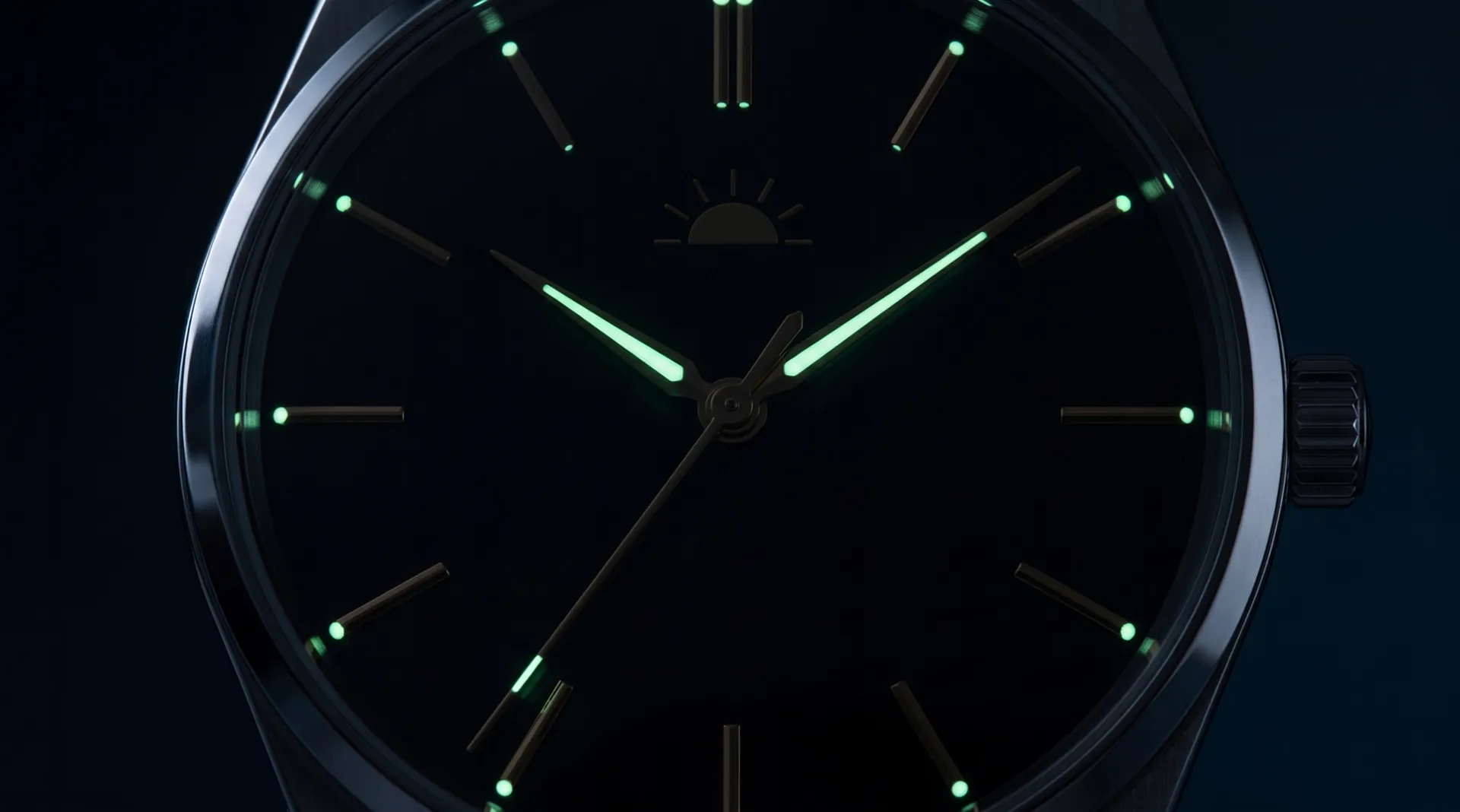 The dial in the dark: the hour and minute hands and a dot at every marker glow pale green